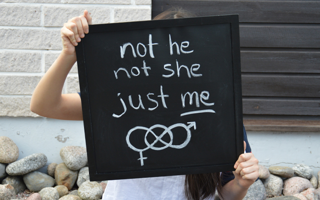Person holding chalkboard