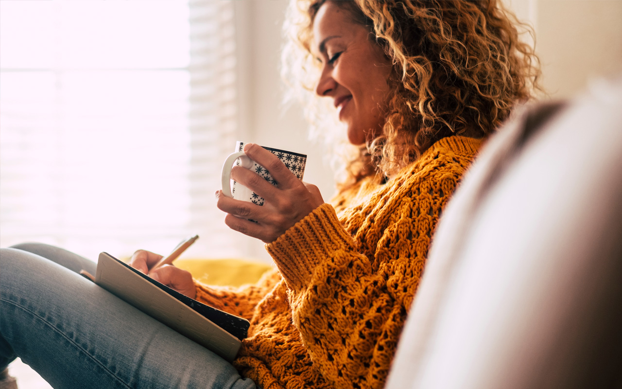 Woman writing in journal